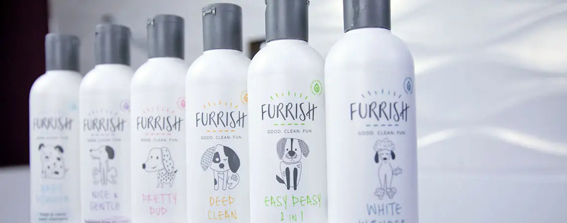 White plastic furrish dog grooming bottles with black caps and cartoon dog illustrations for dog grooming use