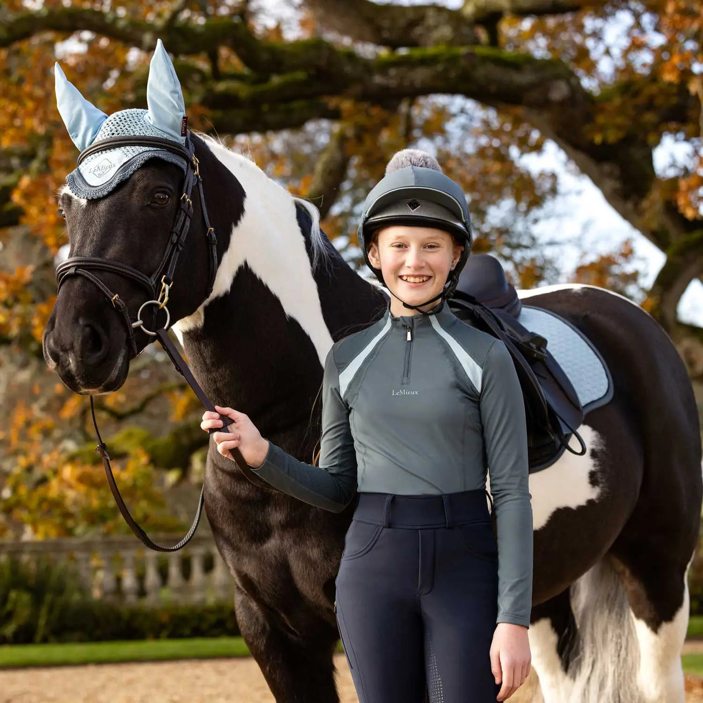 Gray and light blue equestrian helmet from lemieux petrol colour collection with black diamond logo vibrant petrol design