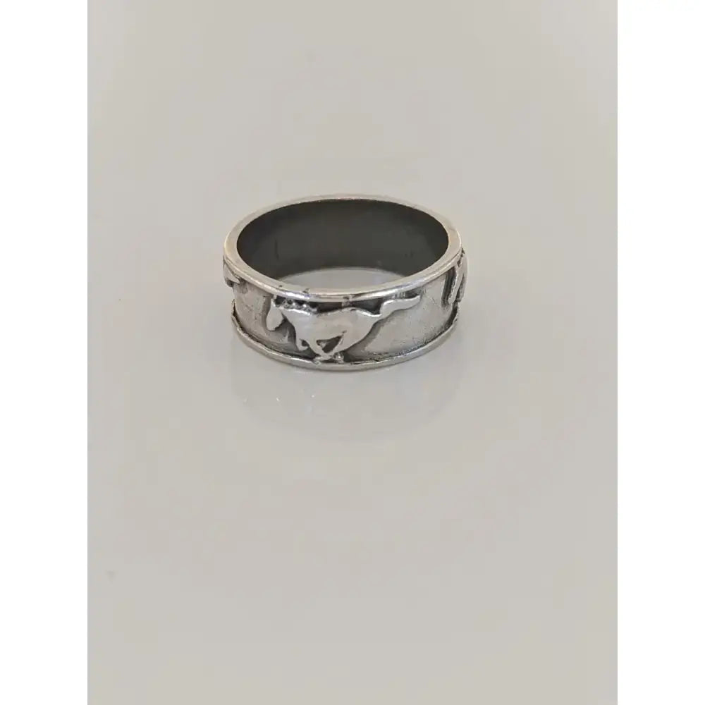 Silver galloping horses band made of sterling silver with a raised mustang logo perfect for him or her