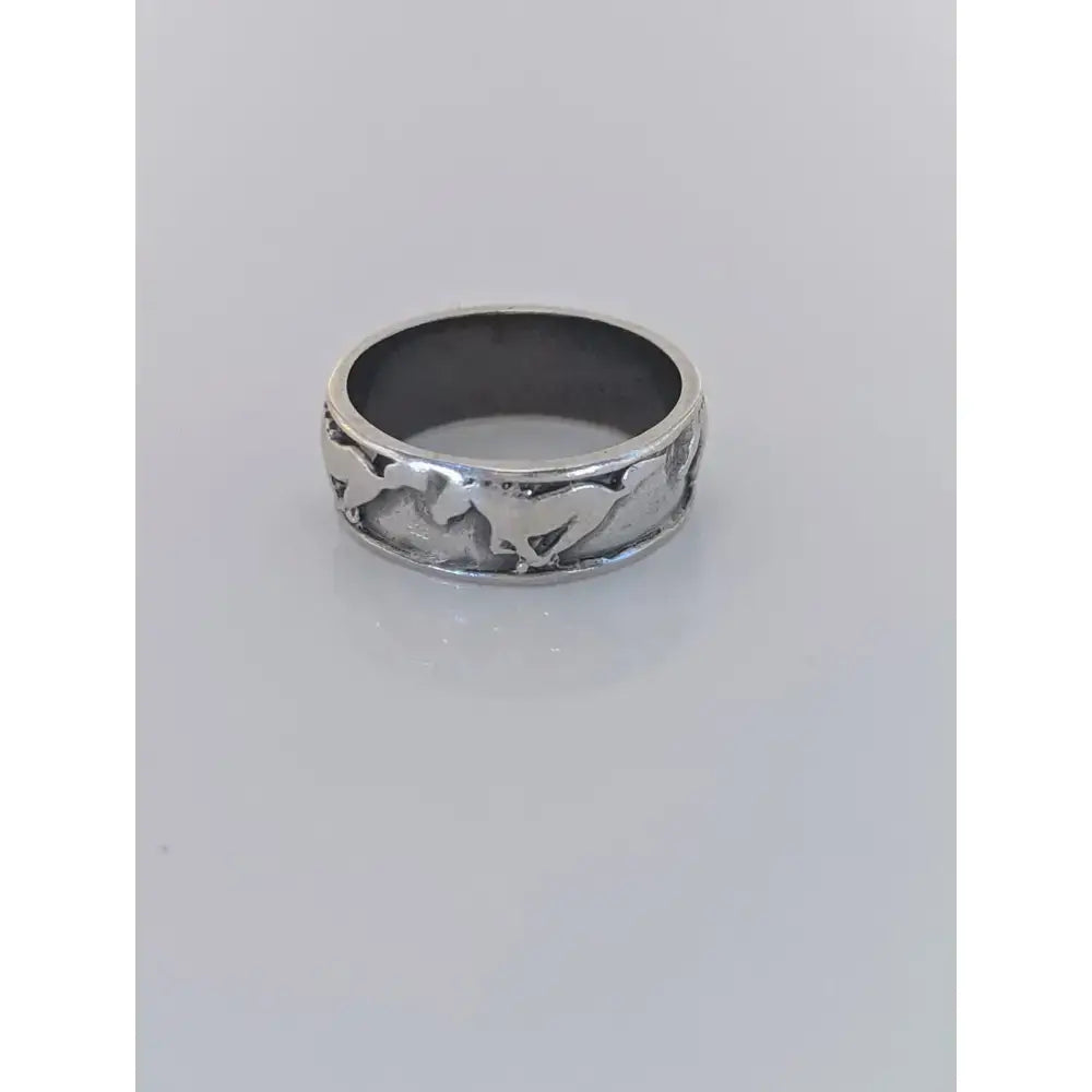Sterling silver galloping horses band featuring an intricate equestrian design for him or her