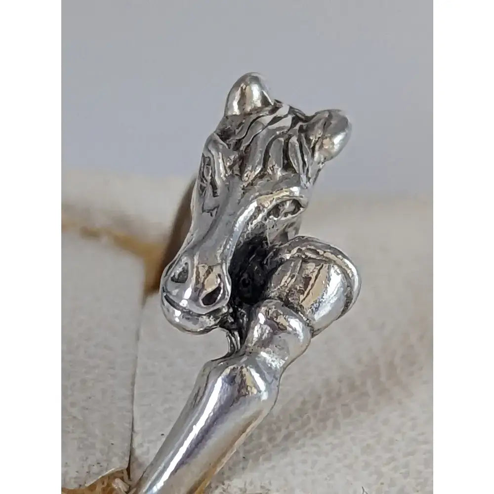 Silver horse head ring with polished 925 silver finish and detailed sculpted features perfect as a hoof ring equestrian gift