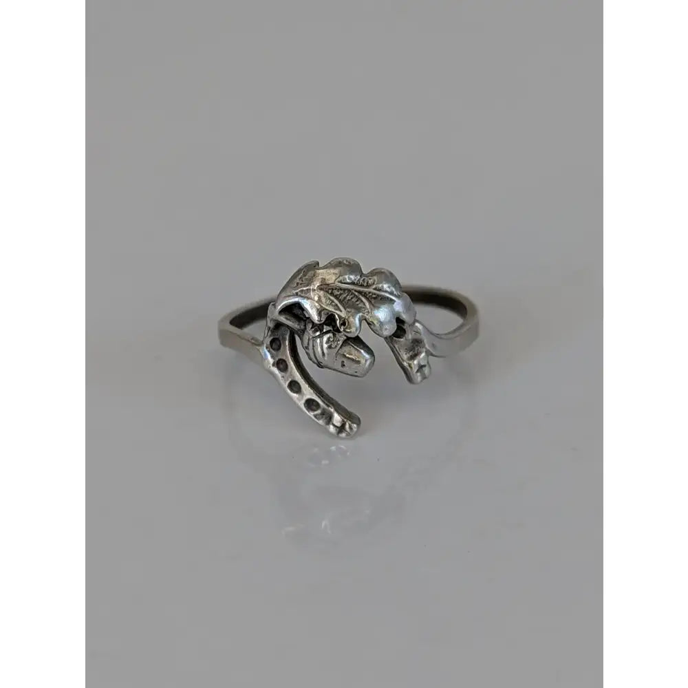 Silver horseshoe ring with detailed oak leaf and acorn design crafted in 925 silver symbolic nature gift
