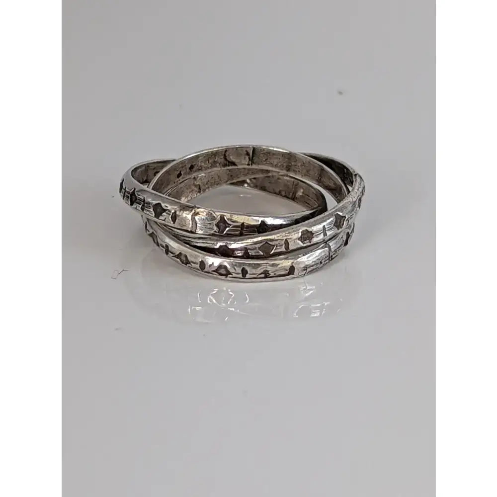 Silver interlinking bands ring with intricate engraved diamond patterns handmade equestrian jewellery by silver steed