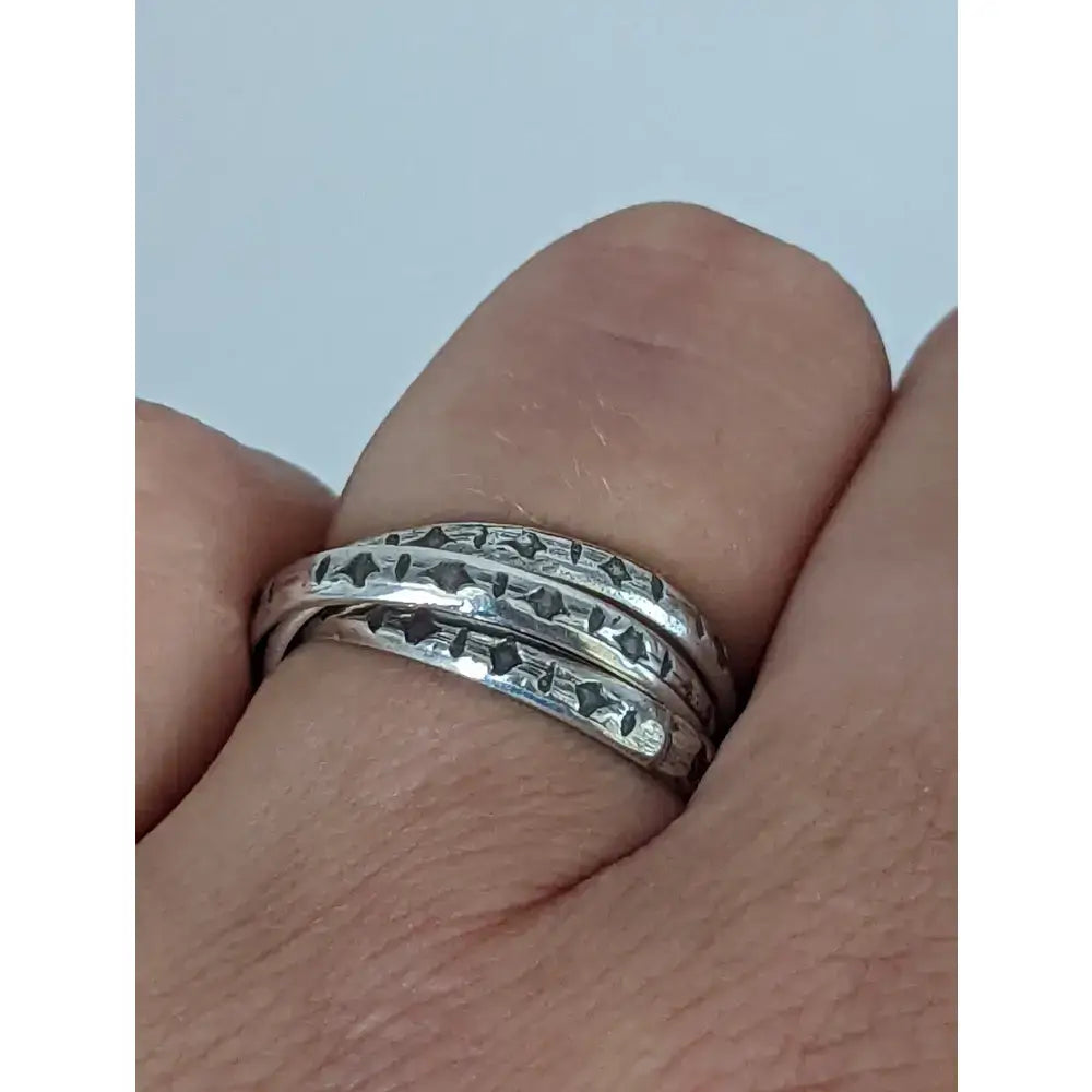 Silver interlinking bands sterling silver ring with engraved star and geometric patterns handmade equestrian jewellery