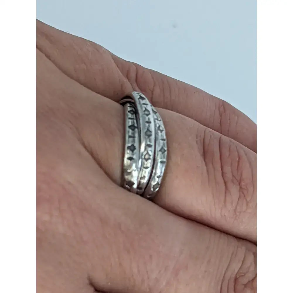 Silver interlinking bands ring in sterling silver with intricate geometric engravings handmade equestrian jewellery