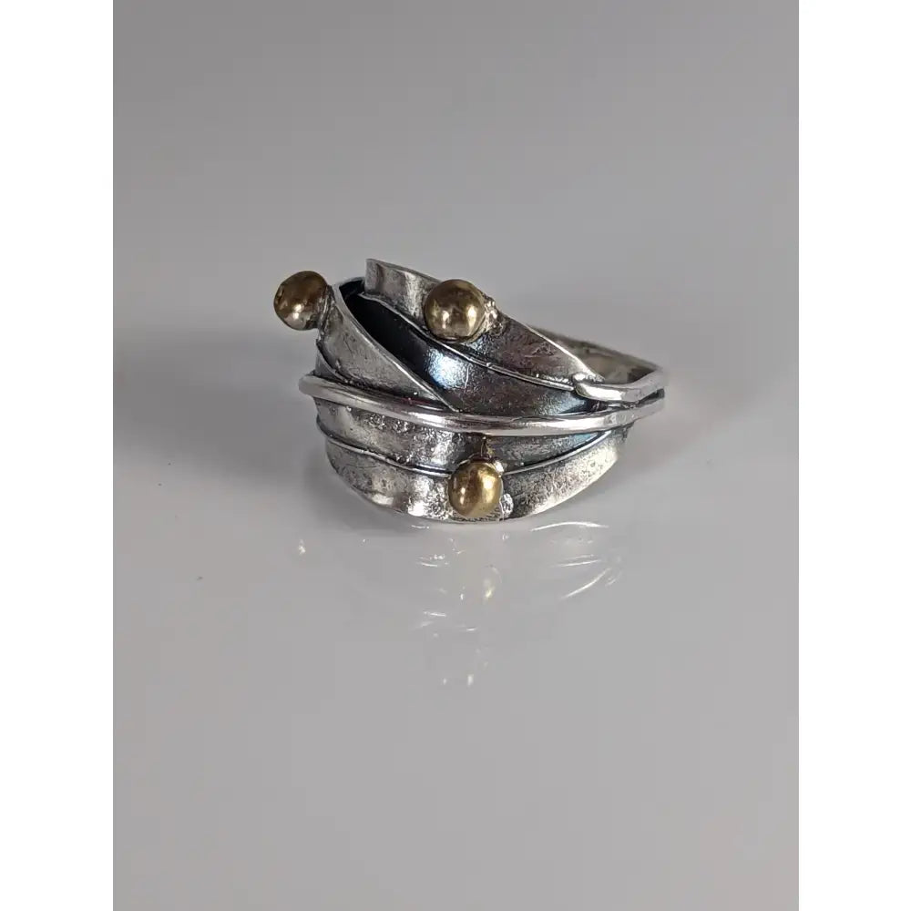 Silver leaves ring with brass buds artisan features layered silver and gold-toned twisted bands and three spheres