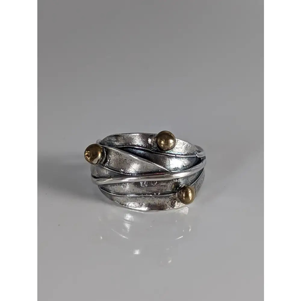 Silver leaves ring with a layered twisted band in silver and gold tones featuring brass buds artisan accents