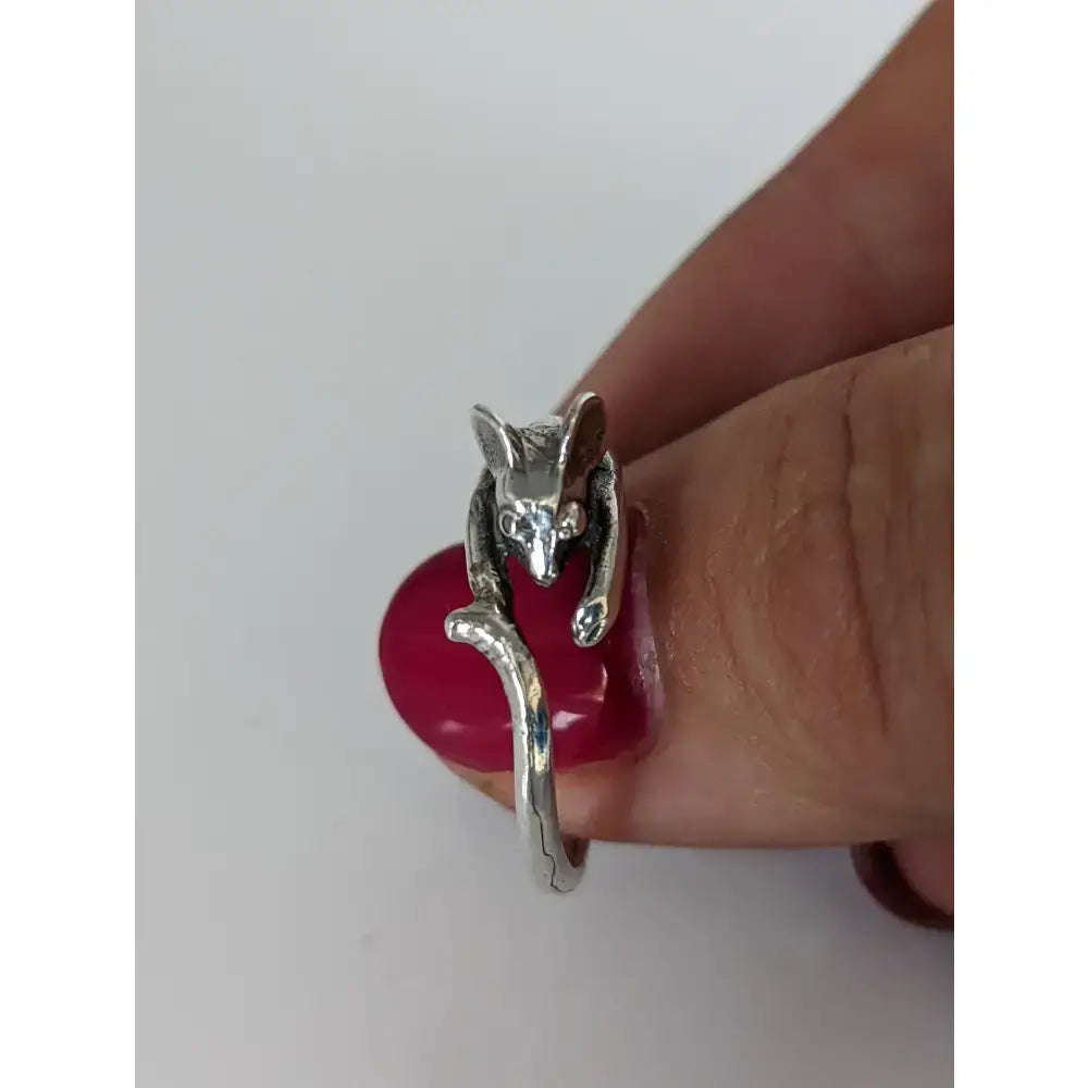 Handmade whimsical wrap-around silver mouse ring with detailed craftsmanship and polished sterling silver finish
