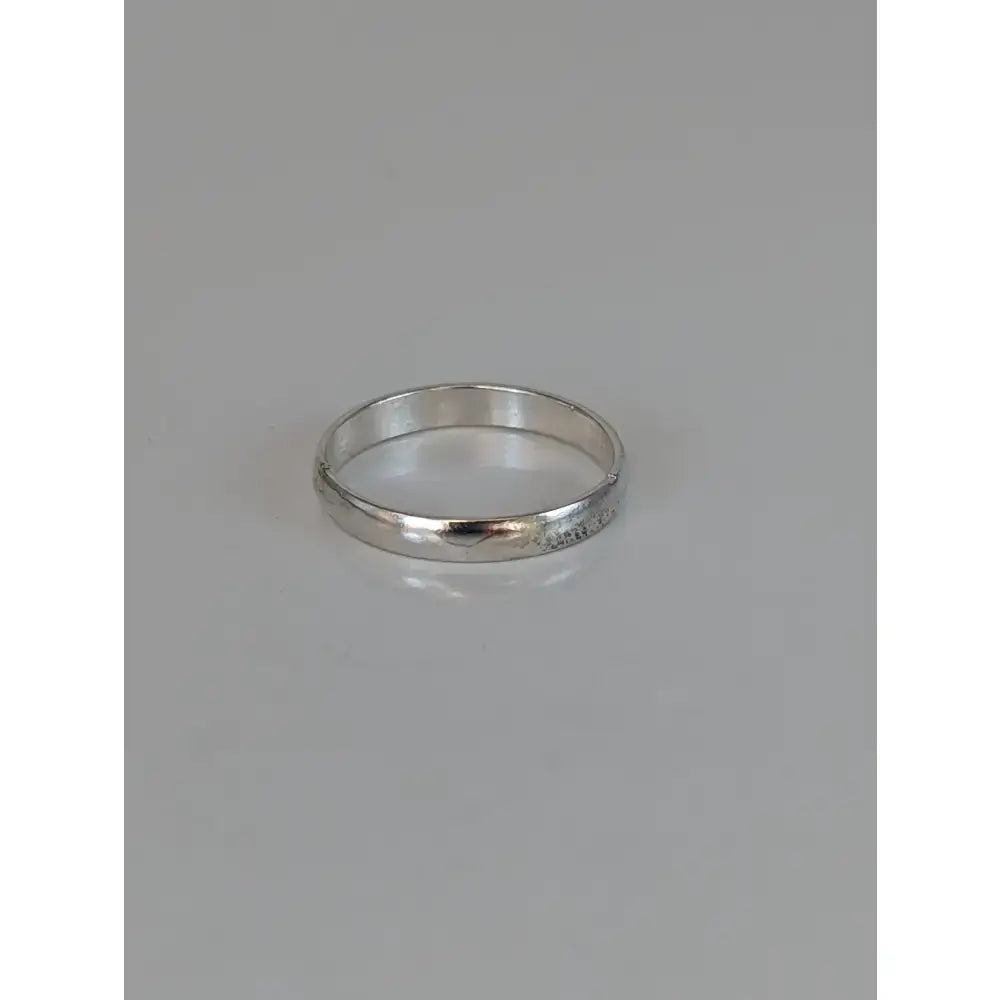 A sleek 925 silver plain band ring with a polished finish and subtle inner texture equestrian ring unisex minimalist band ring