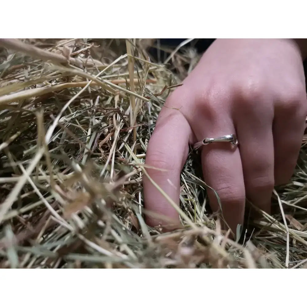 A sleek silver snaffle bit ring with flat band design handmade as an equestrian gift for him or her