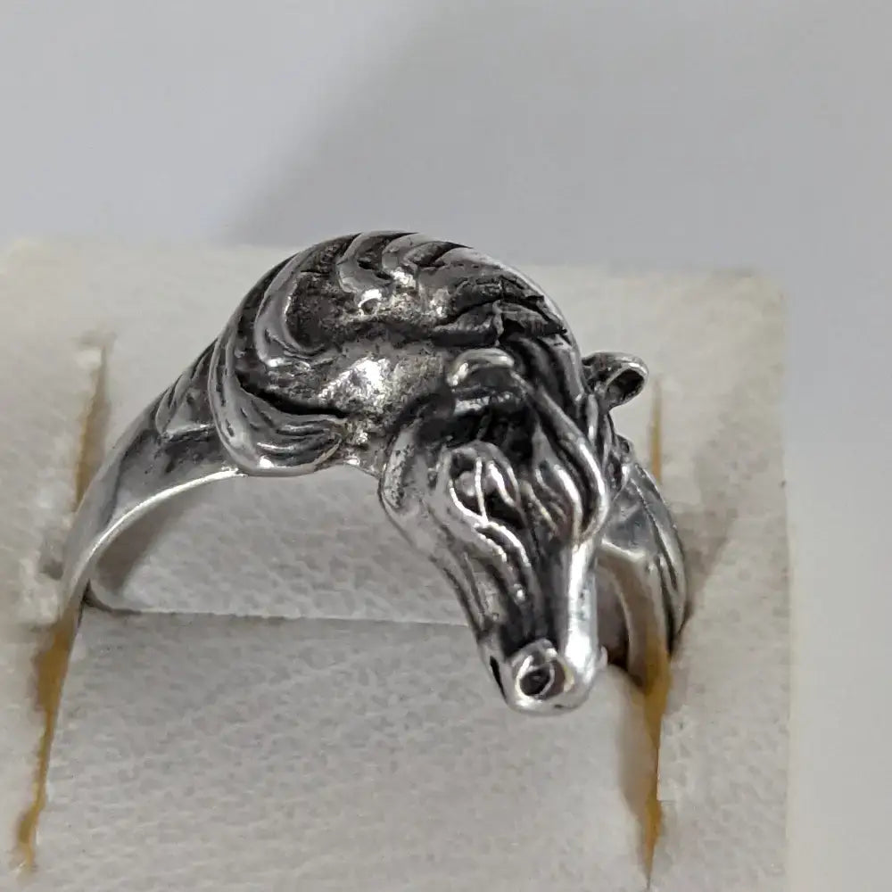 Silver steed horse head ring with intricate detailing and polished finish for a bold equestrian statement
