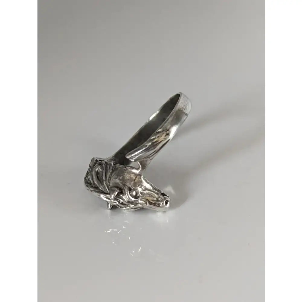 Silver steed horse head ring with intricate detailing and polished finish for a bold equestrian statement