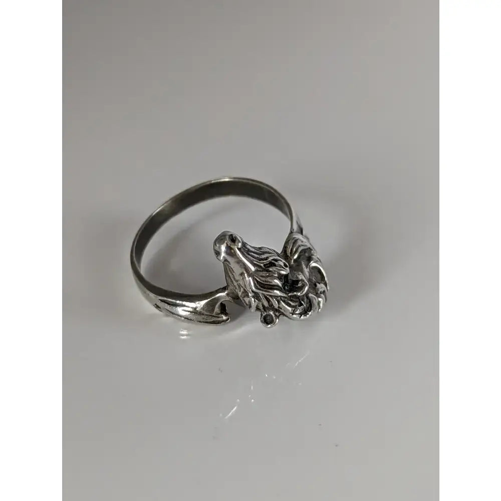 Silver wolf head ring with detailed fur and sharp features complements the bold equestrian statement of 925 silver steed horse head ring