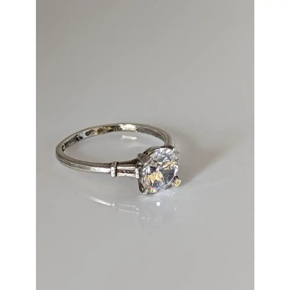 Silver zirconia ring with a round brilliant-cut zirconia and handmade elegant sparkle on a textured band