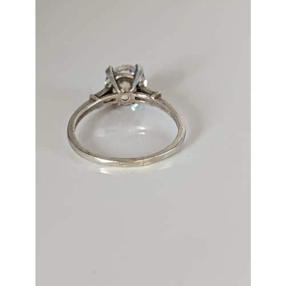A classic silver zirconia ring with a brilliant-cut zirconia stone in a sleek band offering handmade elegant sparkle