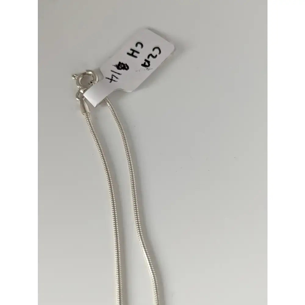 Silver sterling silver chain necklace with secure clasp and white tag from small artisan batches for timeless jewellery