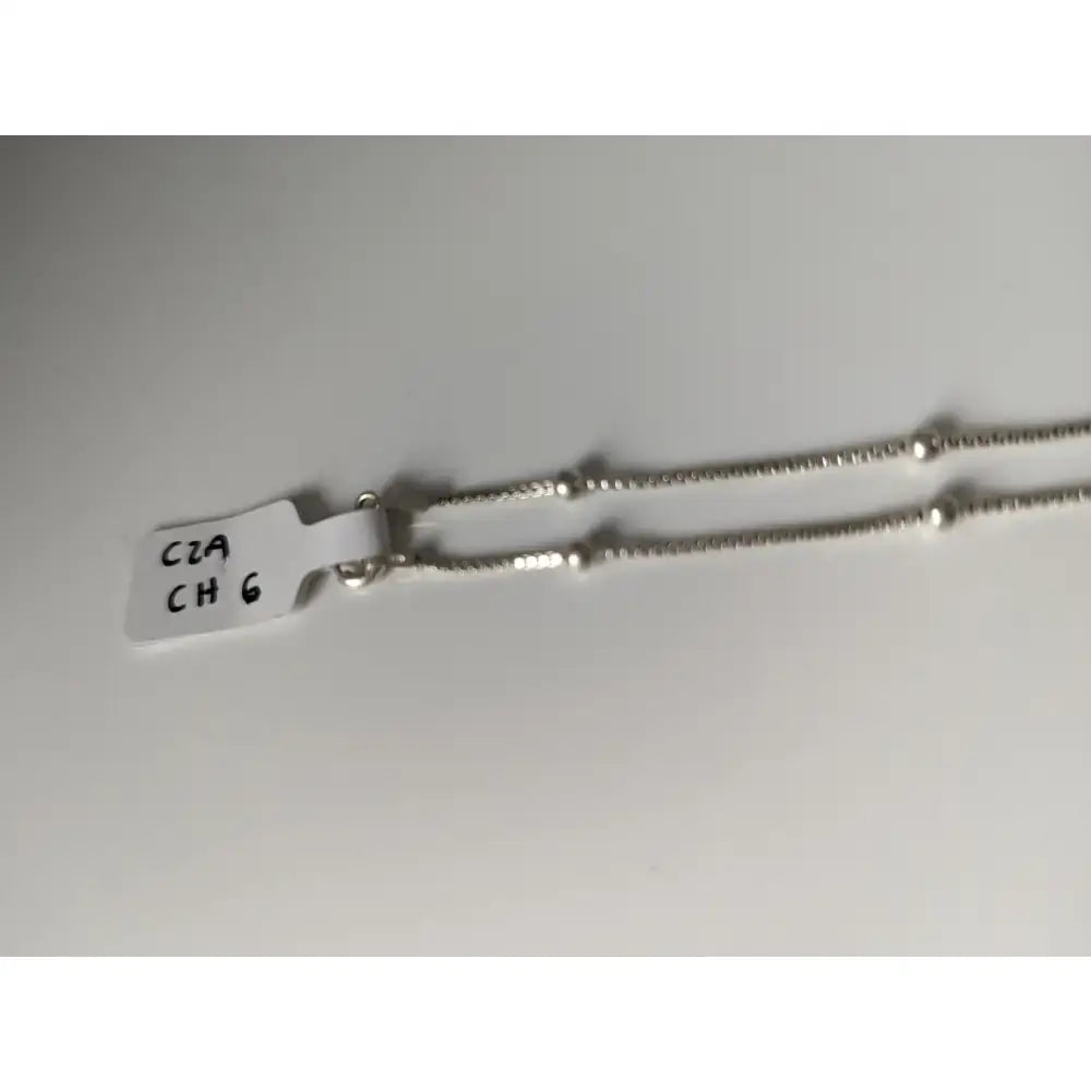 Sterling silver chain necklace with delicate beaded design and small spherical accents from timeless jewellery collection