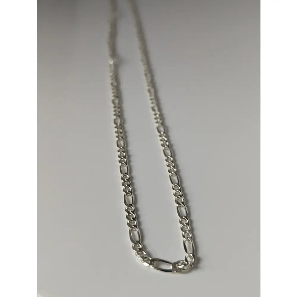 Silver-toned sterling silver chain with sleek interlocking figaro links from small artisan batches timeless jewellery