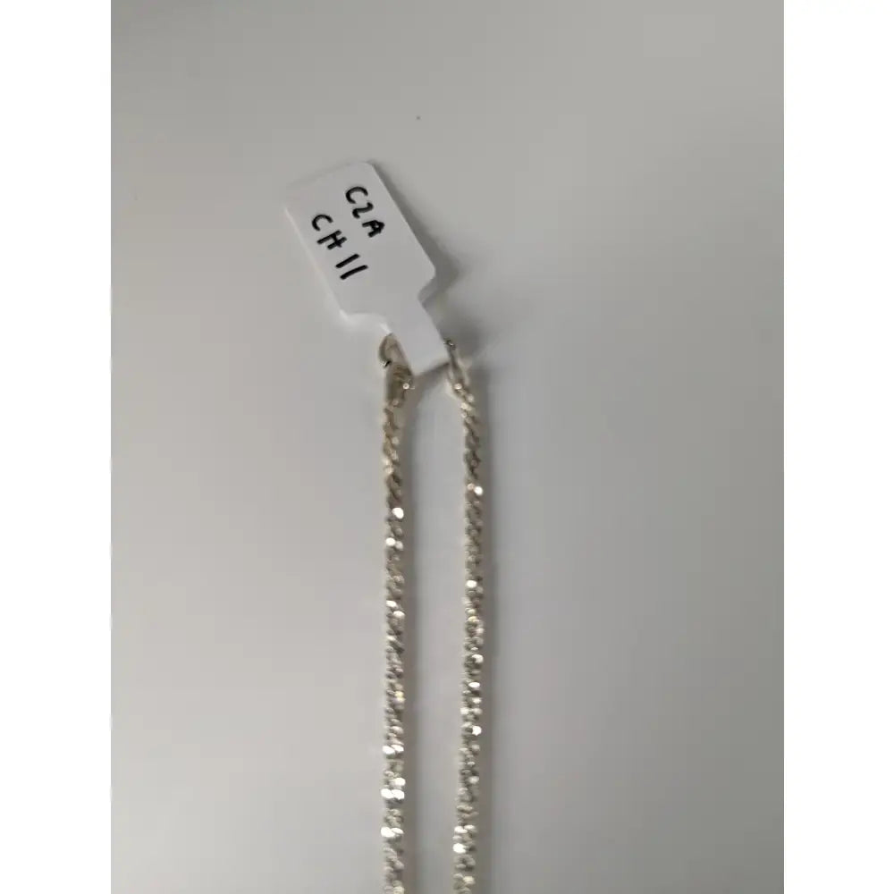 Silver-toned sterling silver chain necklace with twisted links and white tag from small artisan batches timeless jewellery