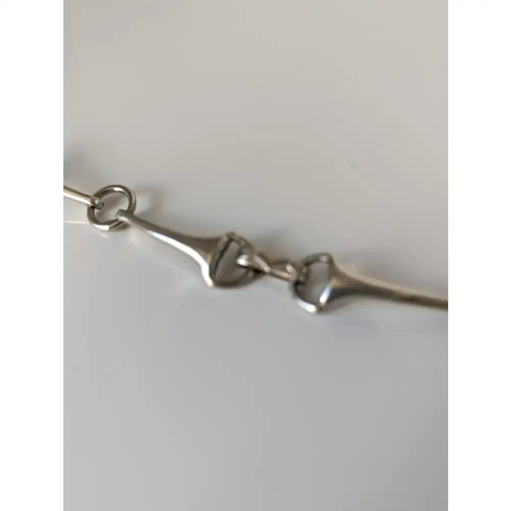 Silver sterling silver snaffle bit bracelet with polished links and handmade equestrian jewelry design