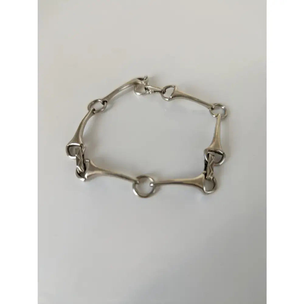 Silver sterling silver snaffle bit bracelet with polished links and secure clasp handmade equestrian jewelry