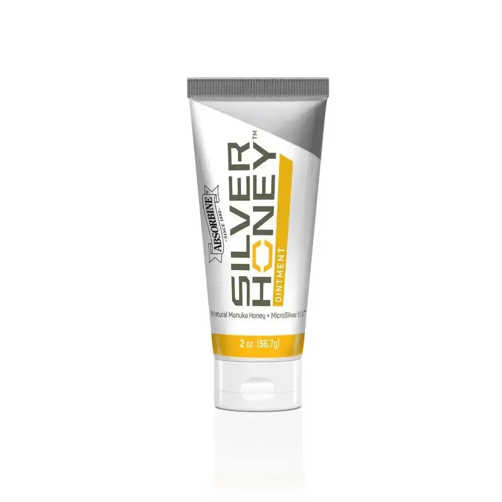 A sleek white and silver tube of absorbine silver honey rapid wound repair ointment with natural manuka honey and microsilver