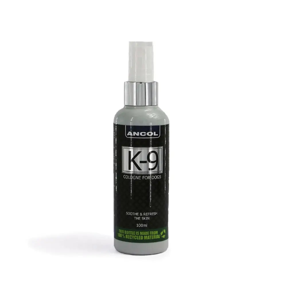 Gray plastic spray bottle with silver metallic cap labeled ancol k-9 cologne energising scent dog colognes