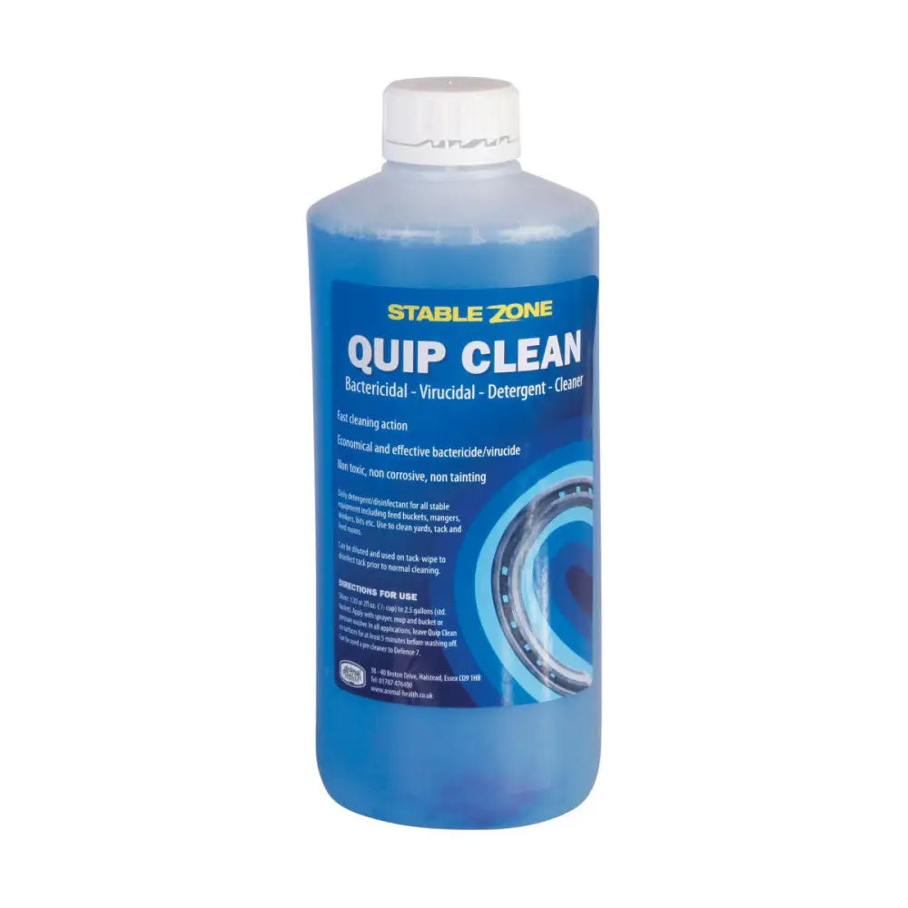 A translucent blue plastic bottle of animal health company quip clean bactericide for stable equipment including feed gear
