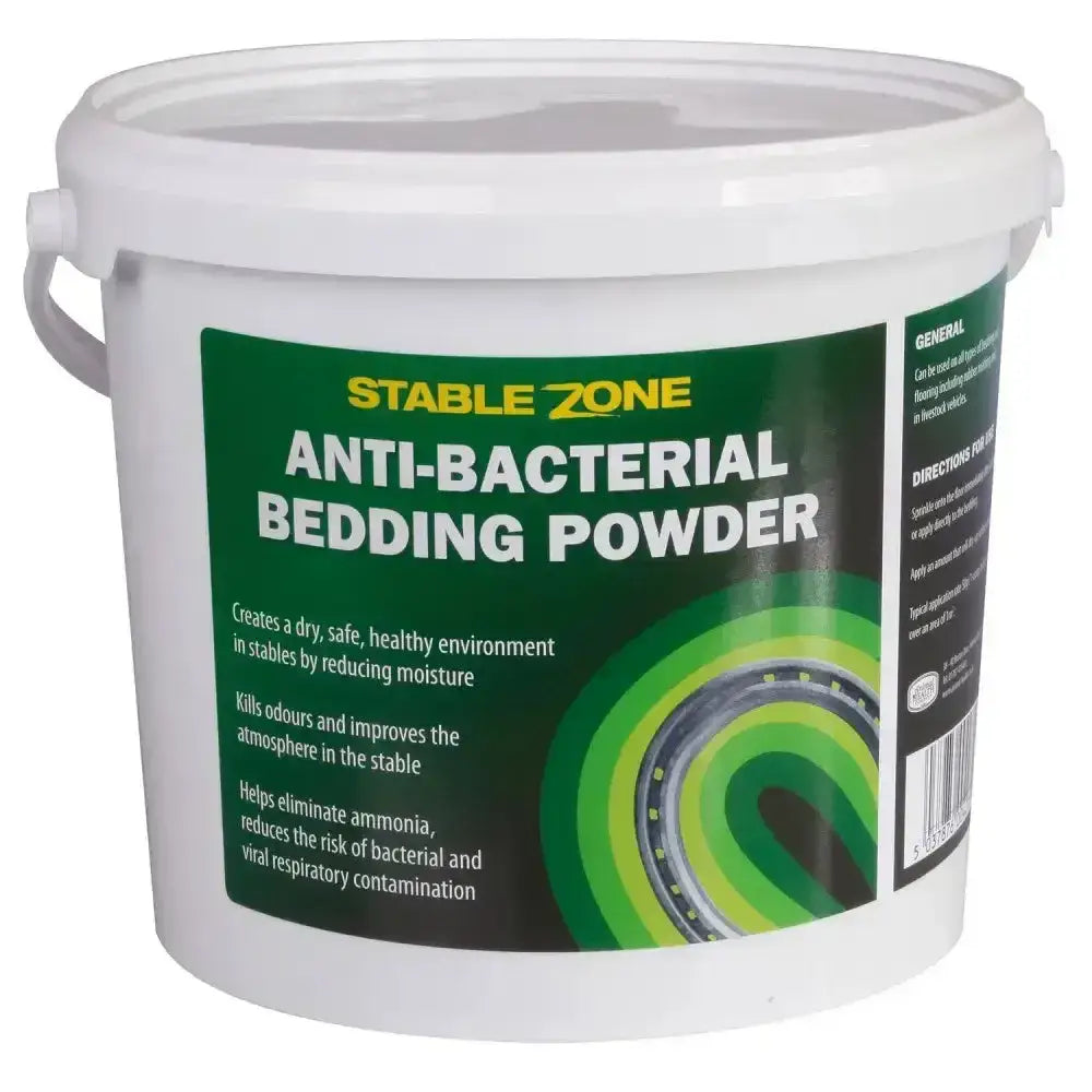 White plastic bucket of animal health company stablezone antibacterial bedding powder with green and black label