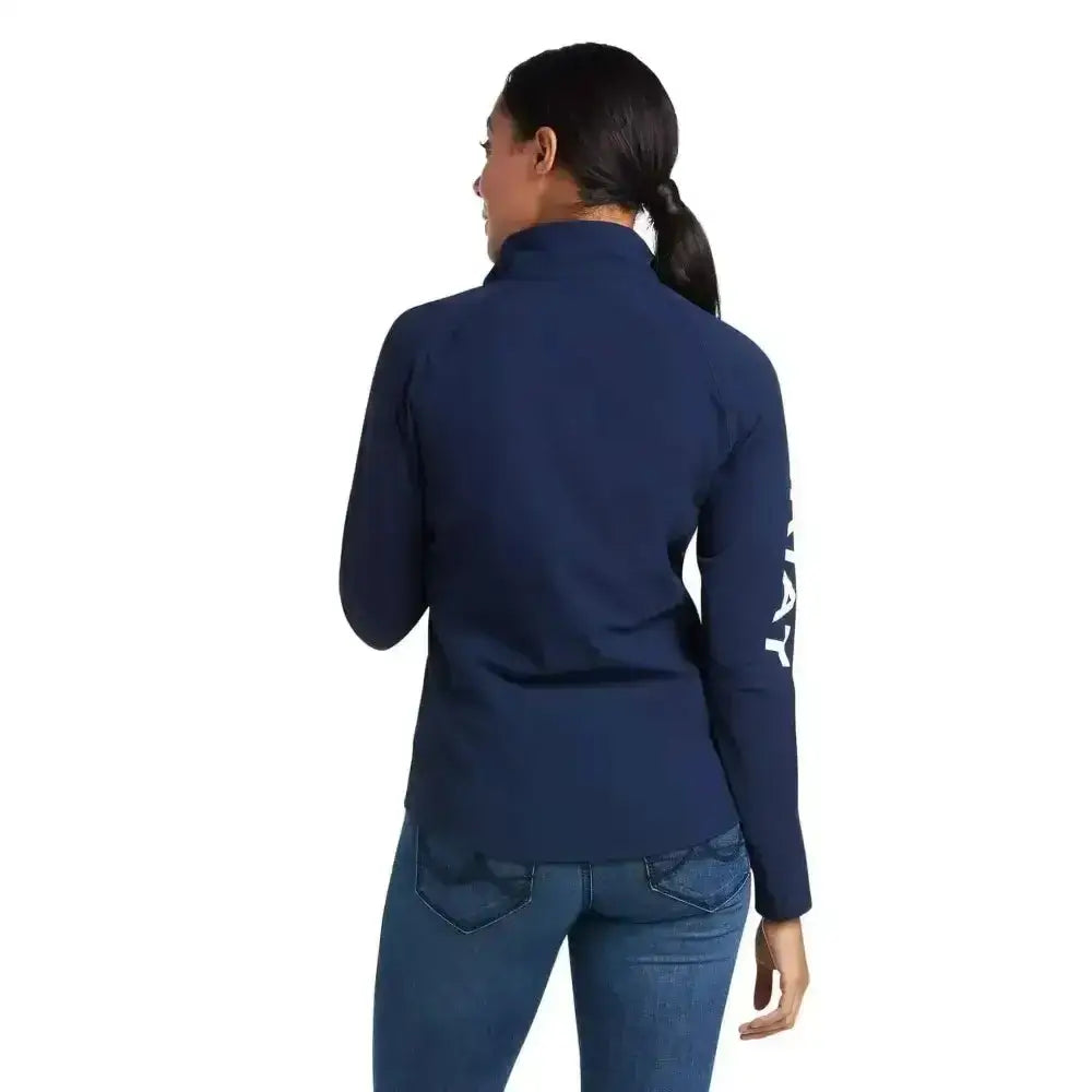 Navy blue long sleeve ariat agile softshell jacket with white vertical lettering on left sleeve zip-up style