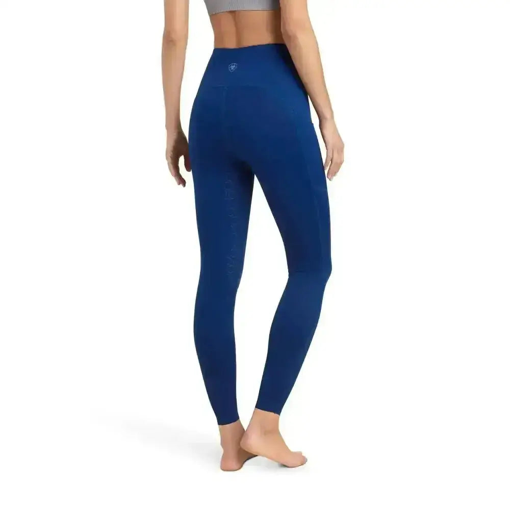 Back view of deep blue ariat ladies riding tights venture thermal half grip with smooth stretchy fabric and logo on waistband