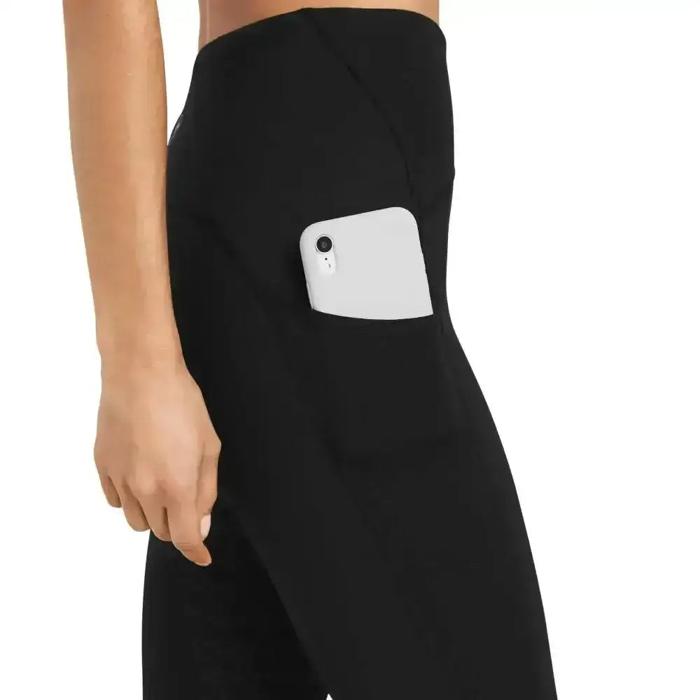 Black ariat ladies riding tights venture thermal half grip with high waist and side pocket holding white smartphone