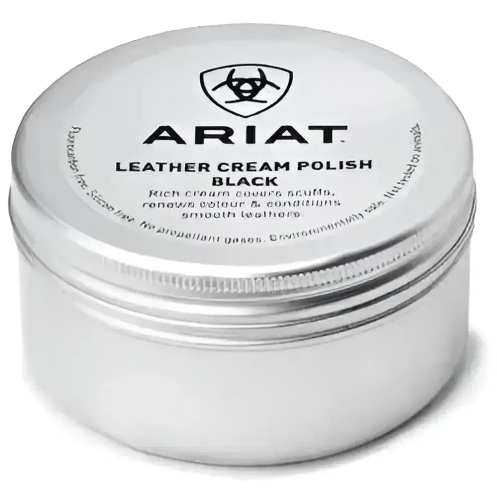 A silver cylindrical tin of ariat leather cream polish with matte finish and embossed branding that covers scuffs