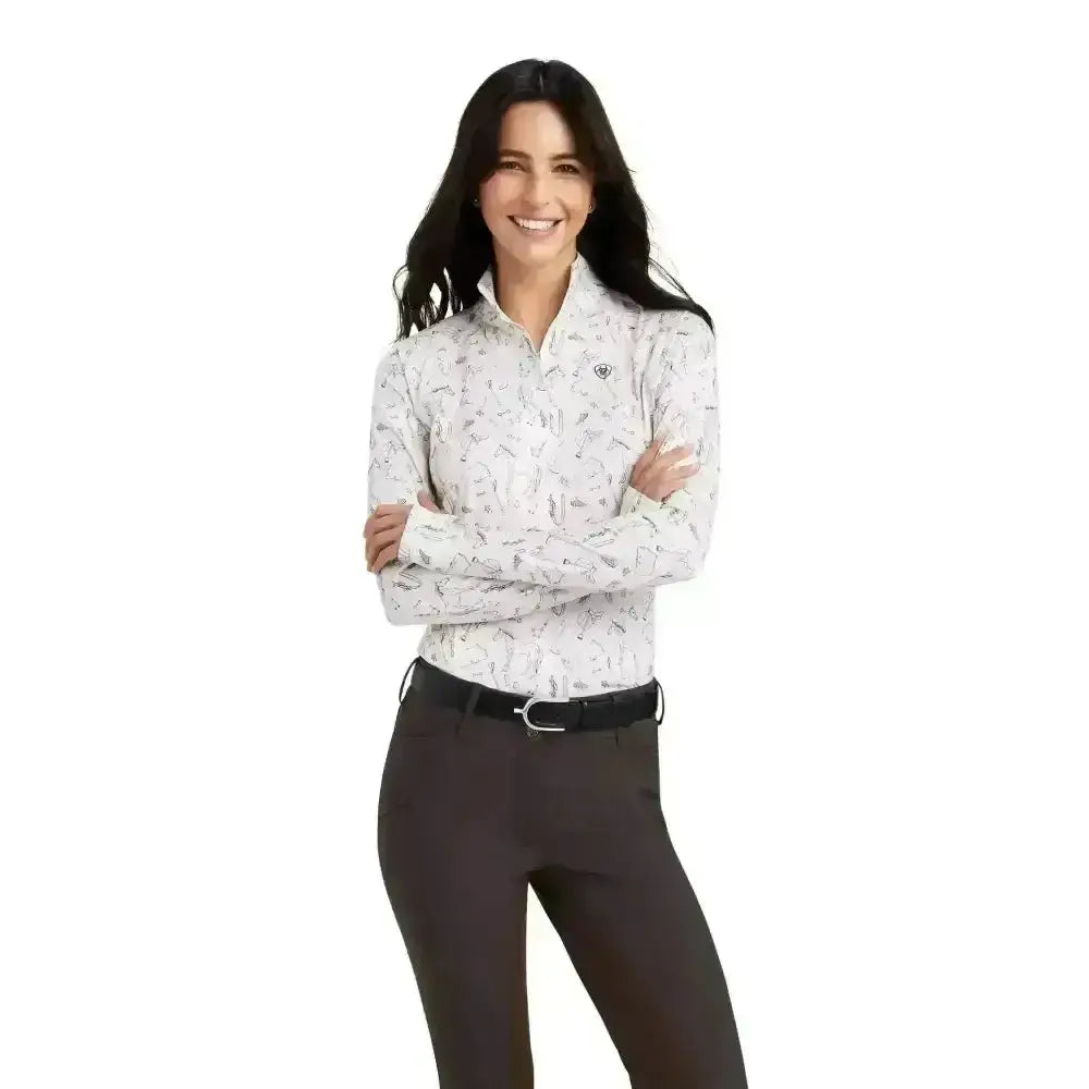 White long-sleeved ariat lowell base layer 2.0 with subtle black feather pattern and chest logo for riding use