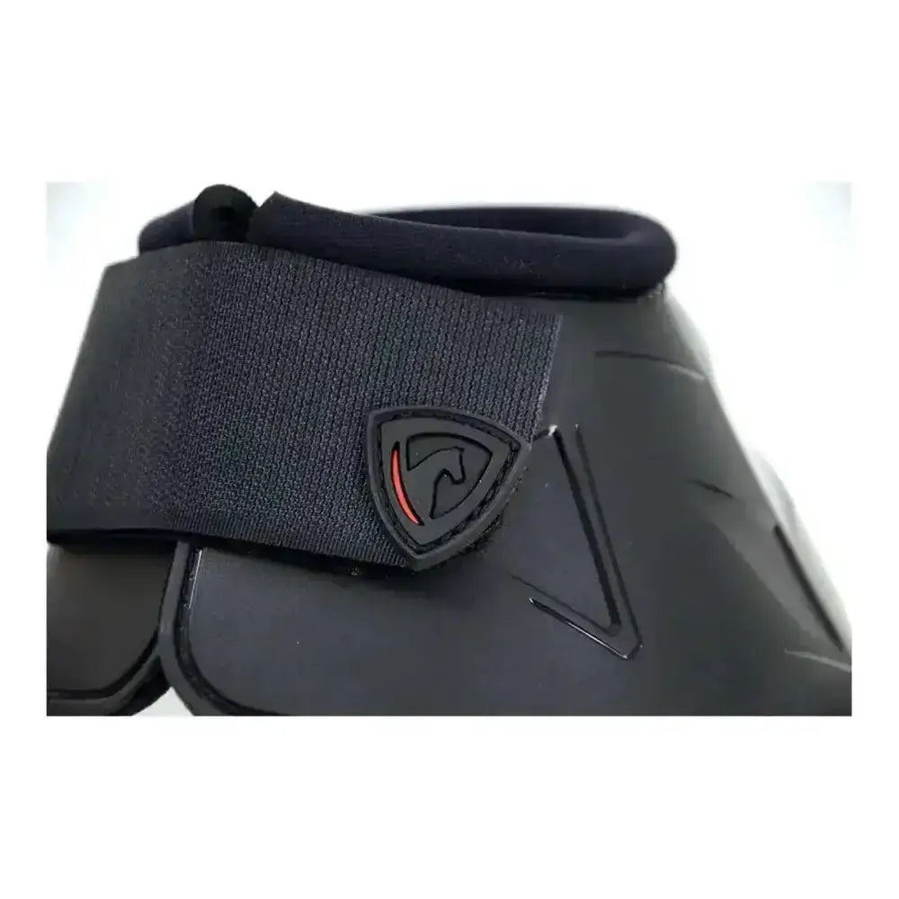 Black armoured guard pro reaction reach boots with textured strap and red shield logo for strong hoof protection