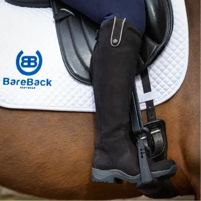 Black bareback footwear montana riding boots with textured upper gray sole and silver buckle detail on the side
