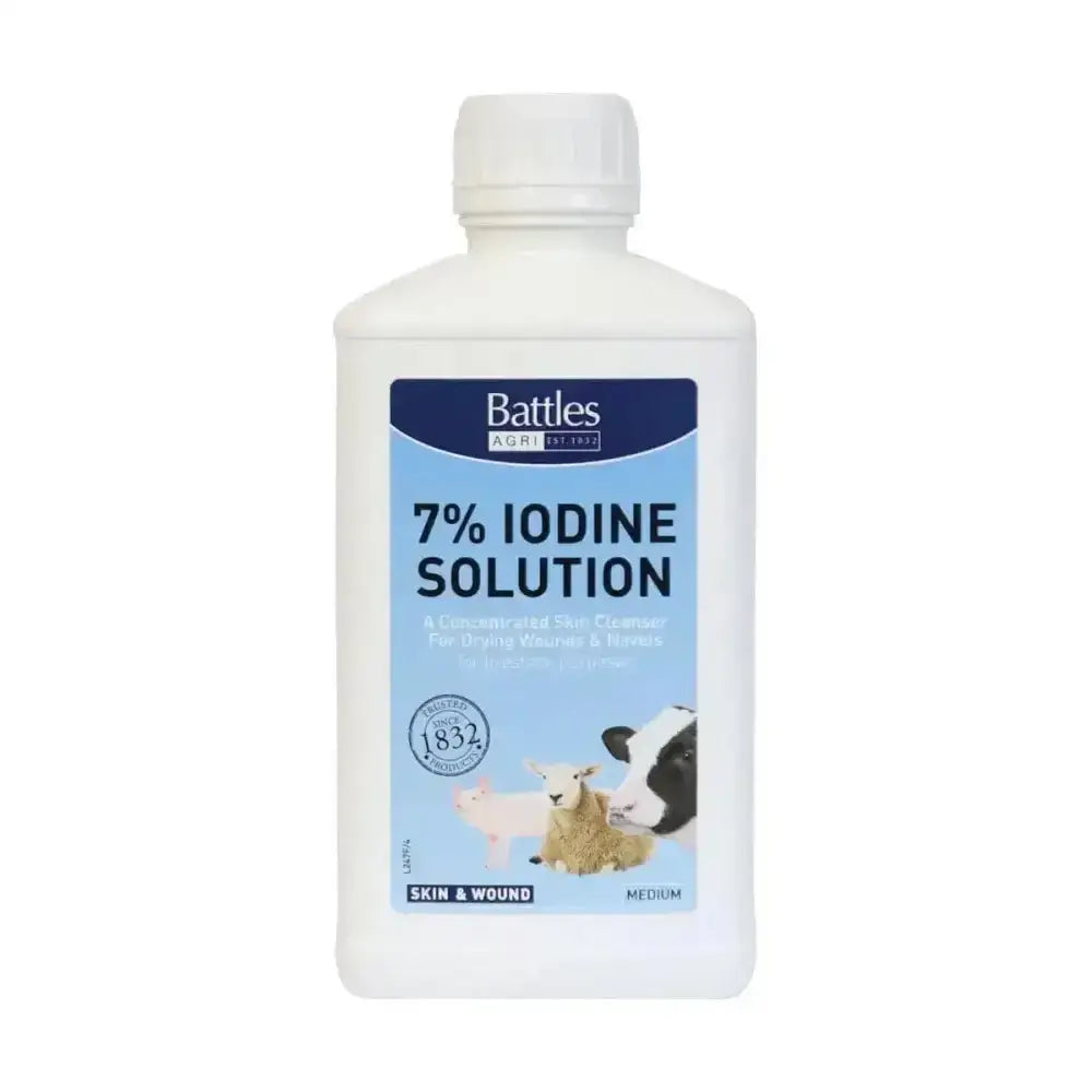 White plastic bottle of battles iodine solution 7 percent with blue farm animal label for skin and wound care