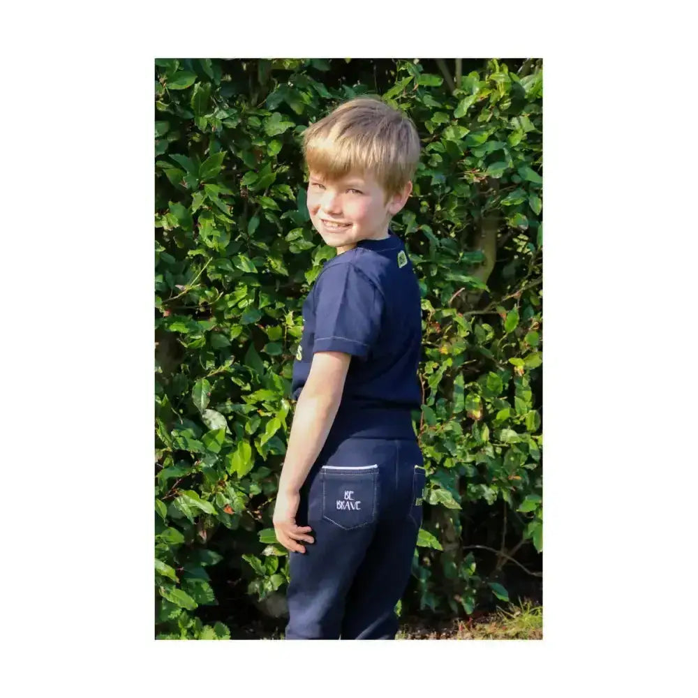 Back view of navy blue children’s pants with be brave patch paired with breathable cotton brave t-shirt for summer months