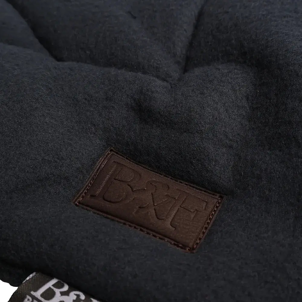Dark gray quilted wool fleece dog bed with brown leather b&h logo patch benji & flo essential fleece dog bed