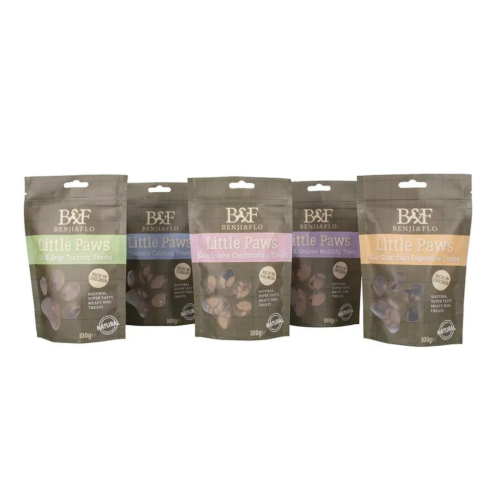 Five benji & flo little paws groove mobility treats in matte brown pouches with colorful bands and clear windows showing treats