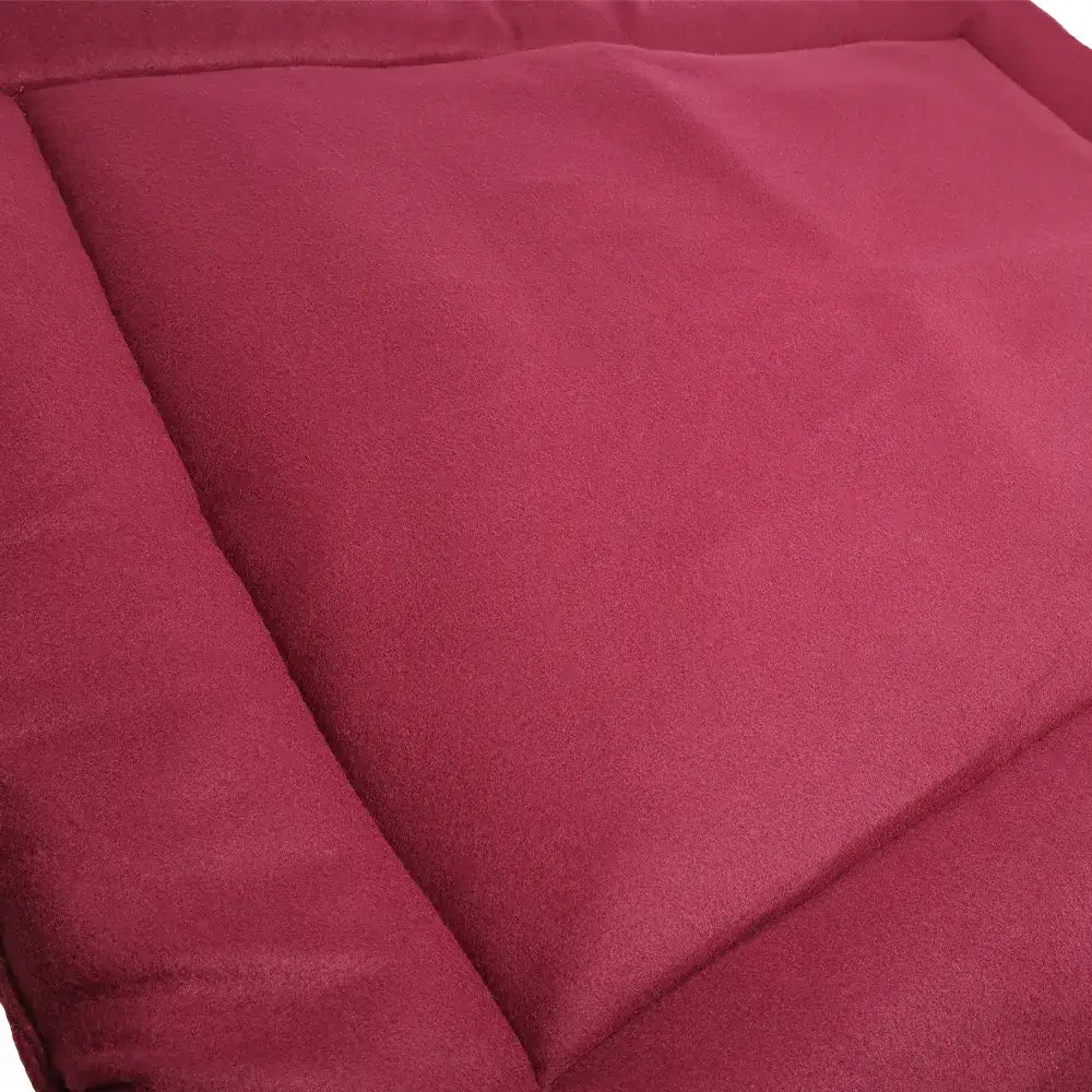 A plush deep red fleece dog bed cushion from benji & flo luxury fleece with soft textured fabric and stitched seams