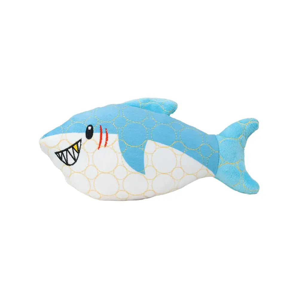 A tough plush shark toy in blue and white with gold circles red gill lines yellow teeth and embroidered black eyes