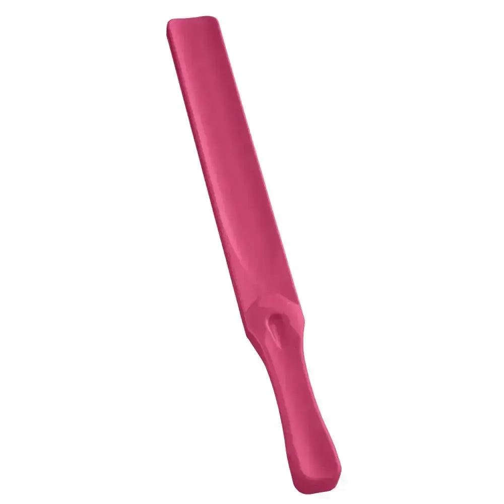 A sleek matte pink plastic bitz feed stirrer with tapered handle and flat blade for brightly coloured feed mixing