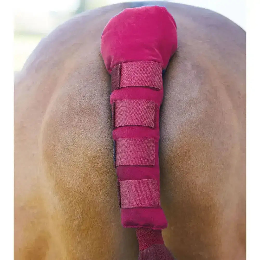A plush vibrant pink bitz tail guard padded with velcro tabs and adjustable velcro straps for secure fit