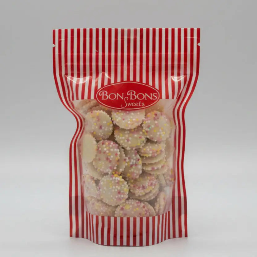 A red and white striped resealable bag of bon bon sweets pouches filled with round cookies topped with colorful sugar coatings