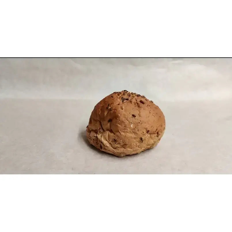 A golden-brown round white bread roll with dark nut specks in bread rolls packs of 2 perfect for snacks