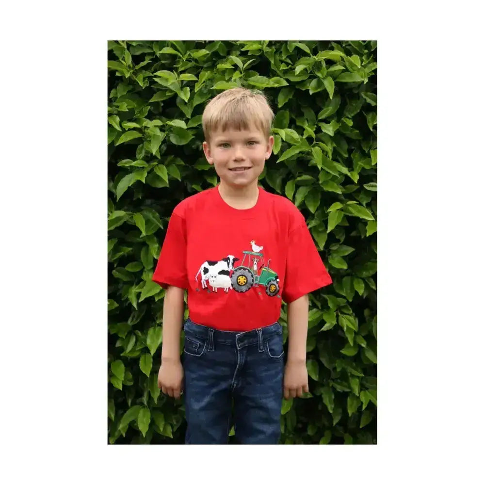 Red short-sleeved t-shirt from british country collection with cartoon tractor and cow graphic farmyard childrens t-shirt