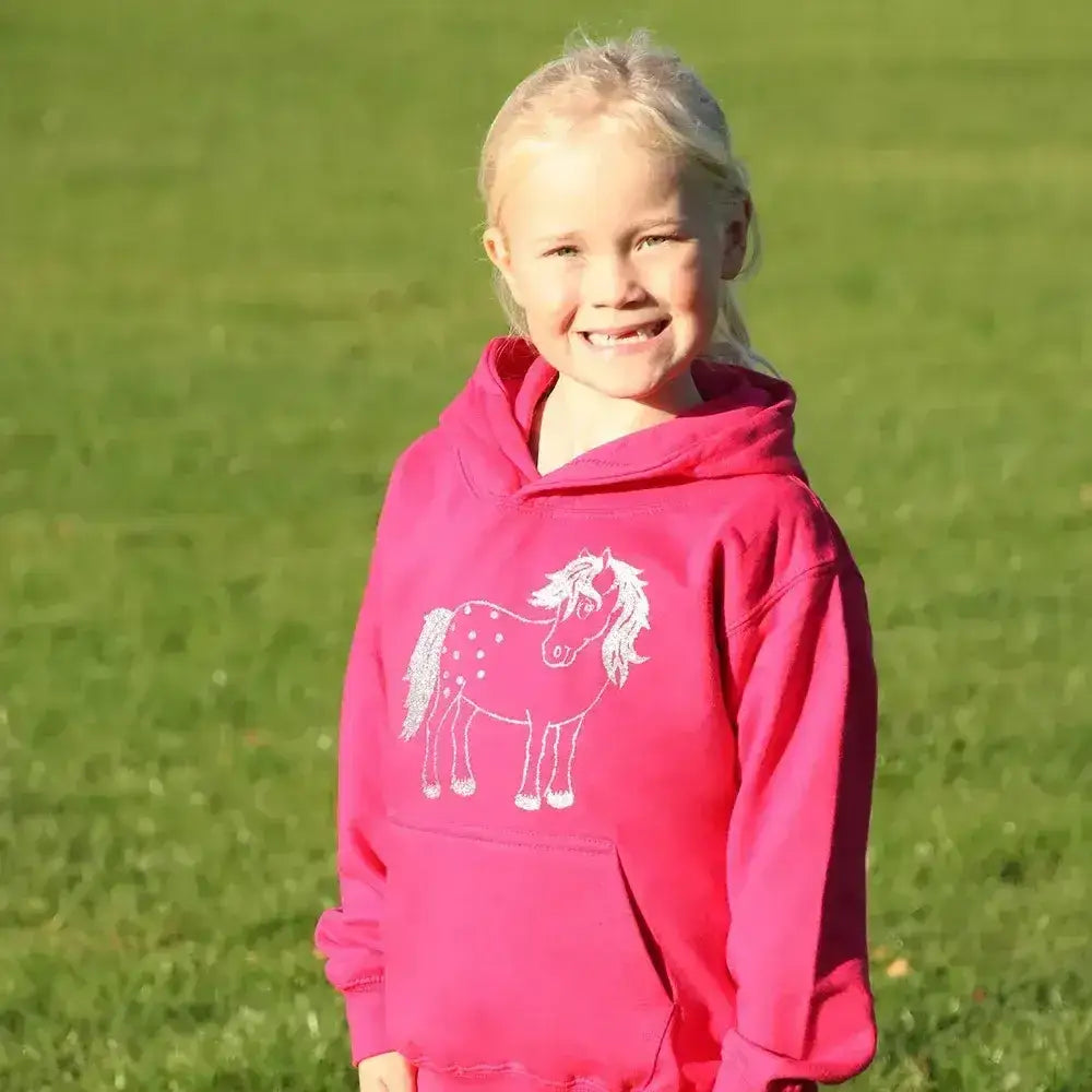 A vibrant pink children’s hoodie from british country collection with a white embroidered twinkle pony glitter design
