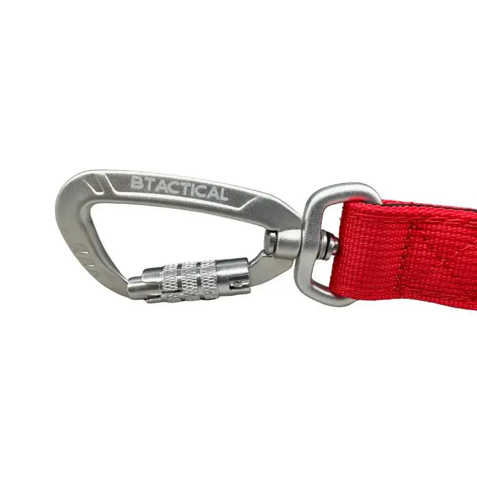 Silver btactical carabiner clip dog lead with textured locking mechanism attached to citrus red triple stitch nylon strap