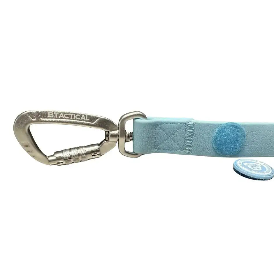 Pastel blue leather dog leash with pvc carabiner clip and circular felt tag featuring anti-tangle swivel buckle